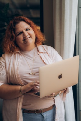 Alexandra Gulamova working on a laptop